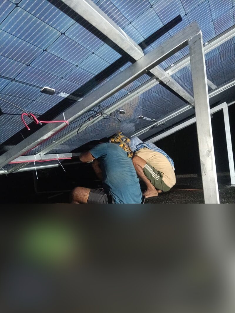 Technicians installing solar panels