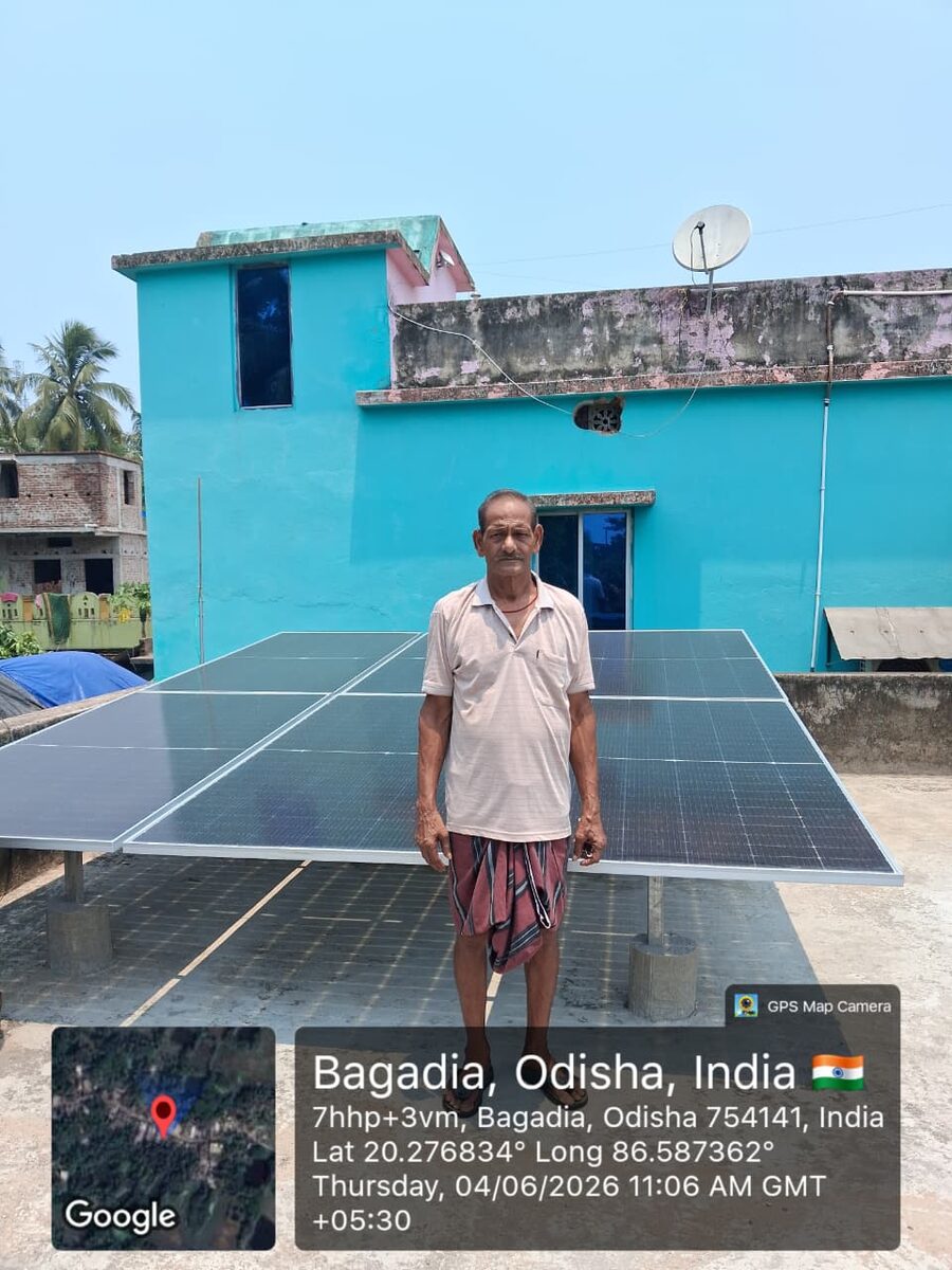 Ground-mounted solar panels with client at Bagadia, Odisha