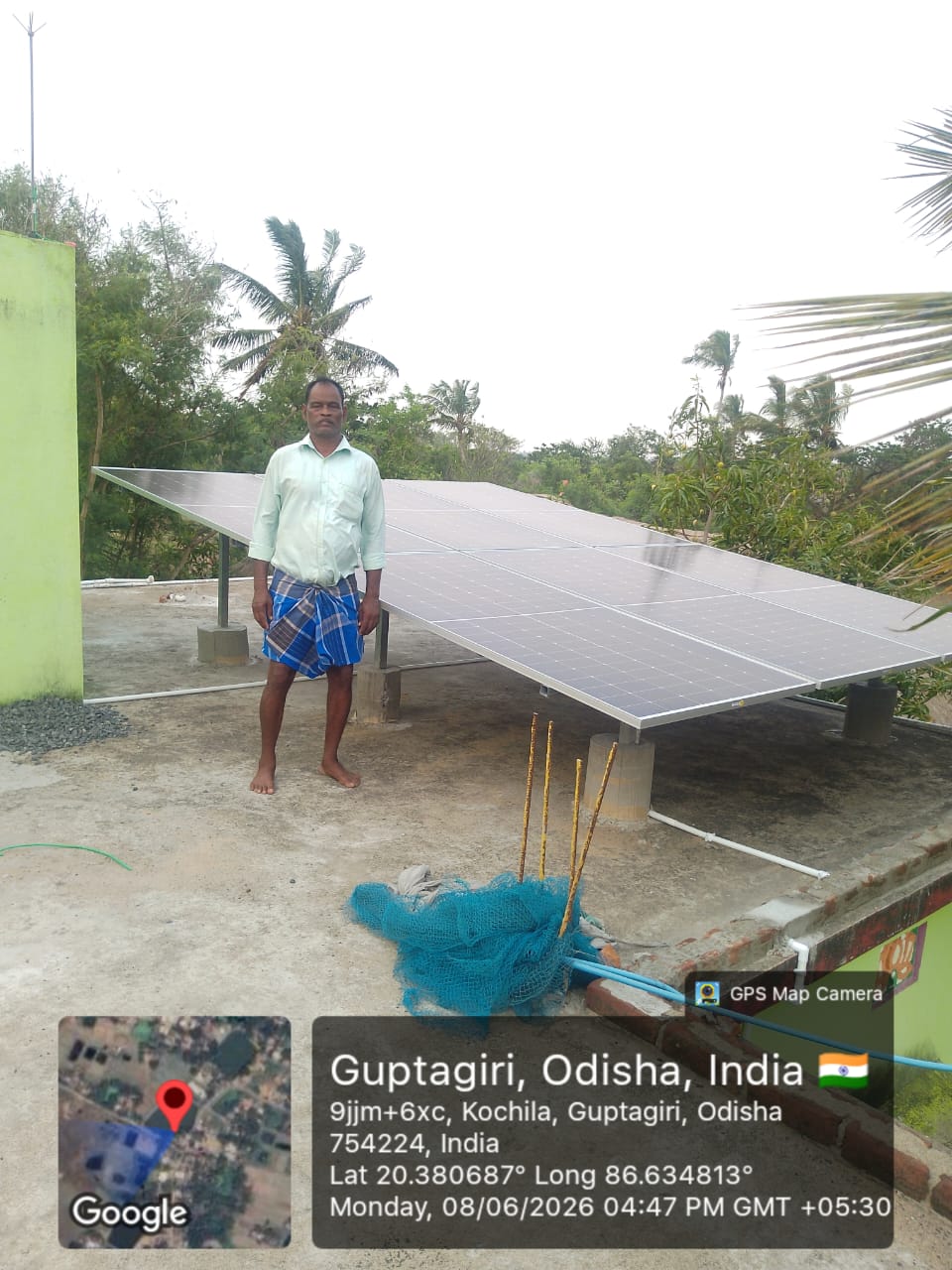 Rooftop solar panel array with client at Guptagiri, Odisha