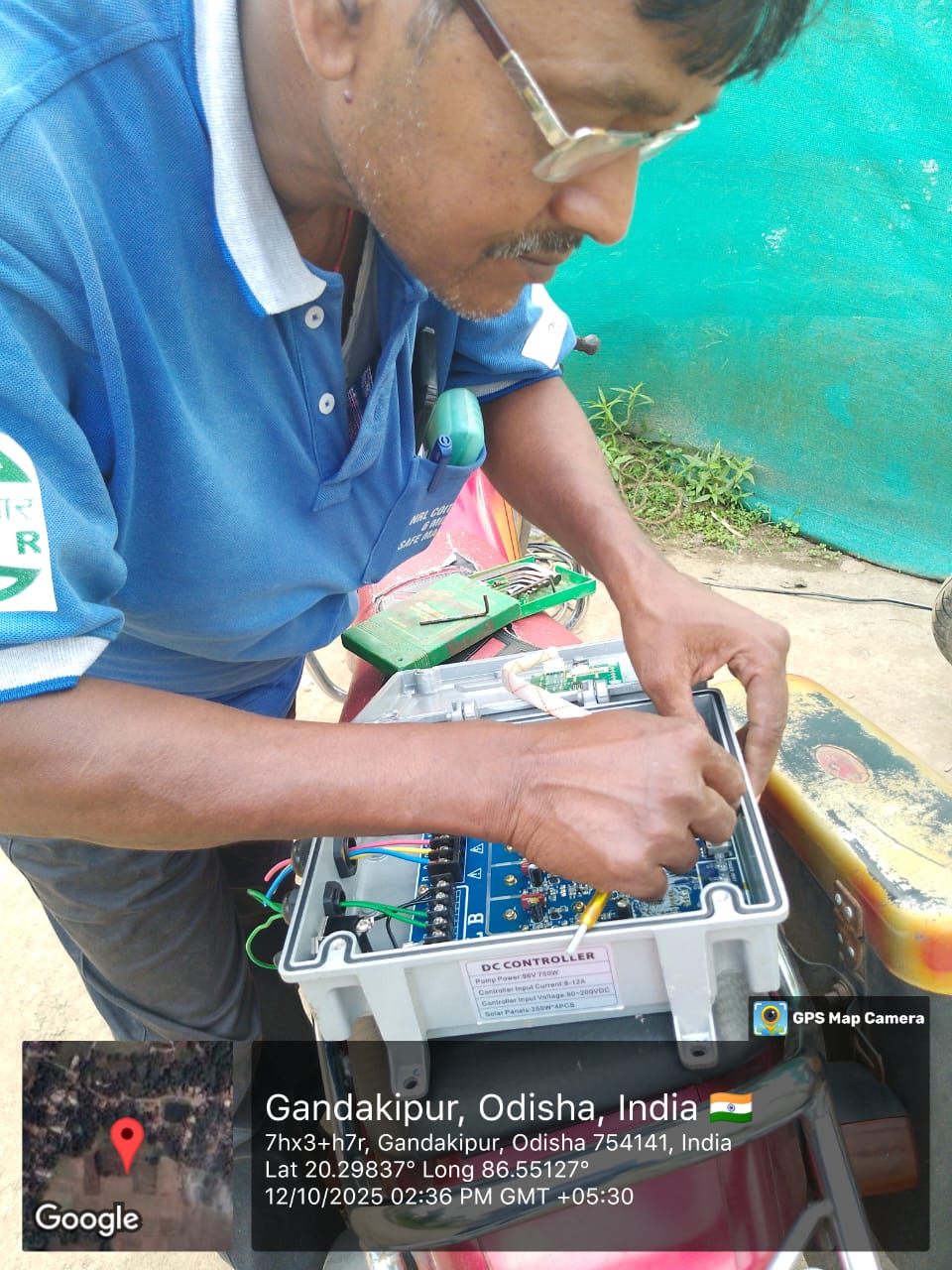 Technician configuring DC pump controller after VFD repair, Gandakipur, Jagatsinghpur